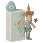 A Maileg Tooth Fairy Mouse in a blue matchbox, adorned with a gold hat and holding a wand, stands next to a mint-colored box featuring the "Dream & Tooth Fairy" text and an illustration of a mouse. On top sits a tooth-shaped container, perfect for sweet dreams.