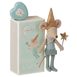 A Maileg Tooth Fairy Mouse in a blue matchbox, adorned with a gold hat and holding a wand, stands next to a mint-colored box featuring the "Dream & Tooth Fairy" text and an illustration of a mouse. On top sits a tooth-shaped container, perfect for sweet dreams.