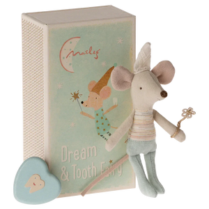 The Maileg Tooth Fairy Mouse, Little Brother in Match Box by Maileg, dressed as a tooth fairy holding a wand, stands next to a matchbox-style case labeled "Dream & Tooth Fairy." A blue, heart-shaped tooth box is also visible in the foreground.