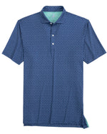 The Johnnie-O Top O The Mornin Polo is a blue short-sleeve golf polo from Johnnie-O, featuring a small white geometric pattern and light green interior lining. It's crafted from a stretchy jersey blend for ultimate comfort and breathability.