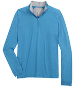 The Johnnie-O Freeborne Quarter Zip, designed by Johnnie-O, is a lightweight blue pullover with long sleeves and a gray inner collar. It features moisture-wicking fabric to ensure ultimate comfort.