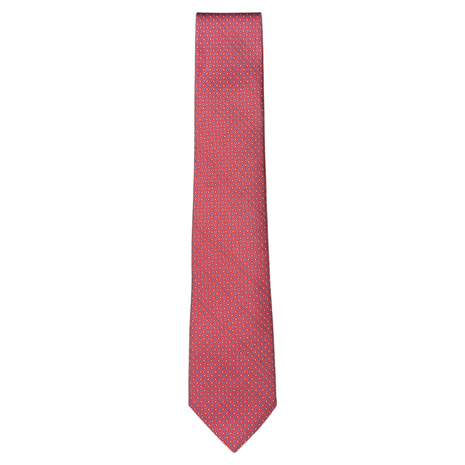 The Robert Jensen Torus Tie is a red silk tie featuring a small blue and white geometric pattern, handmade in Italy and shown against a white background.
