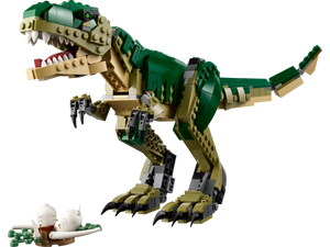 The green and beige LEGO® Creator T. Rex, with its posable limbs and roaring open mouth, stands next to a white model skeleton, showcasing the creativity of Legos - Toyhouse.