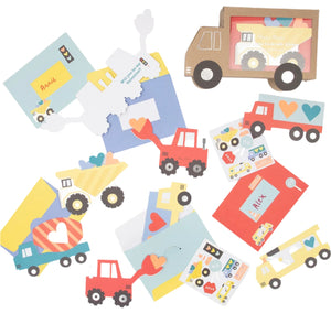 The Meri Meri Truck Kids Valentine's Card Set features vibrant construction-themed paper cutouts with trucks, hearts, and fun stickers for making unique truck Valentine's cards.