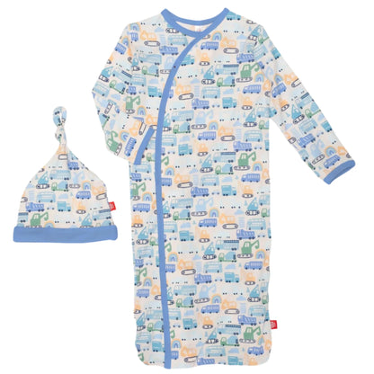 The Magnetic Me As Truck Would Have It Gown and Hat NB-3M is an infant sleeper set featuring a vehicle pattern with cars, trucks, and buses. It comes with magnetic closures for convenience and is crafted from soft TENCEL™ modal.