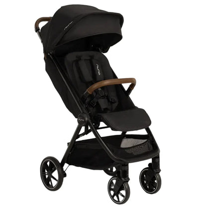 Introducing the Nuna TRVL lx Stroller by Nuna: a luxury black stroller featuring a curved handlebar, four wheels, and a protective canopy. The seat is equipped with a safety harness and there’s a convenient storage basket underneath. Experience compact freedom with its one-handed fold feature, making it the ideal choice for on-the-go parents.