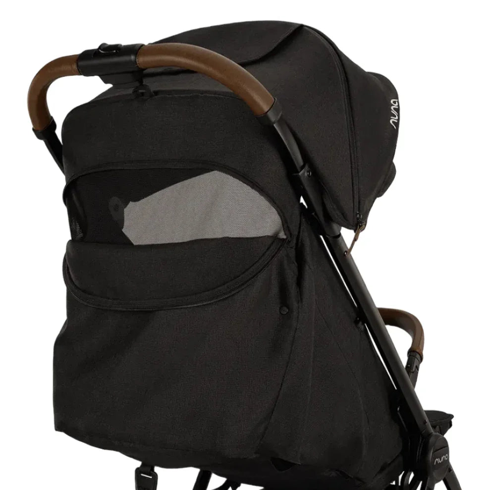 The Nuna TRVL lx Stroller by Nuna is a luxury stroller in black, boasting a brown handle, mesh window, adjustable canopy, and the convenience of a one-handed fold for compact freedom.