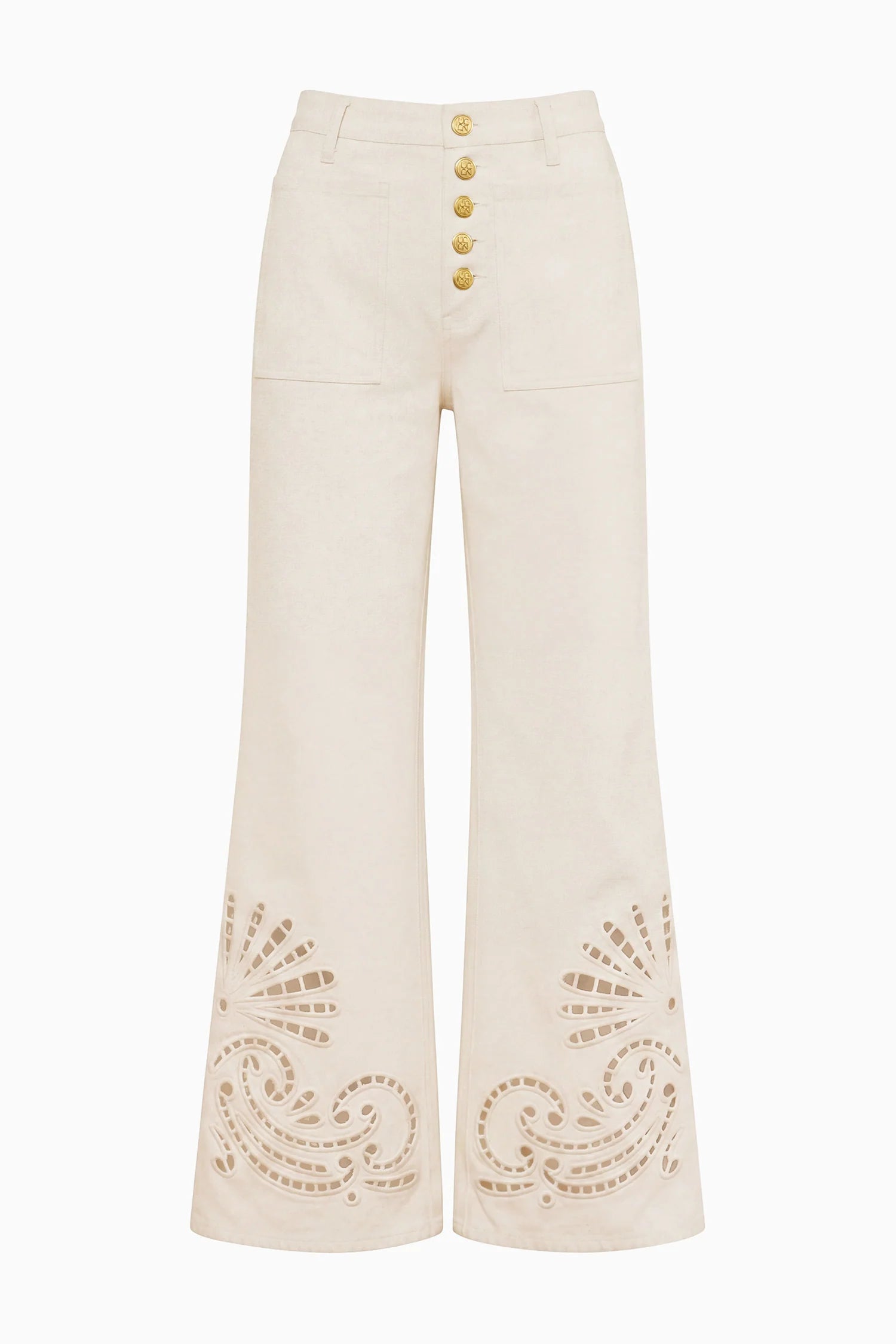 Lou Eyelet Jean by Ulla Johnson: High-waisted white flared denim pants adorned with gold buttons and laser-cut paisley detailing at the hem, finished with delicate eyelet embroidery for a vintage-inspired look.