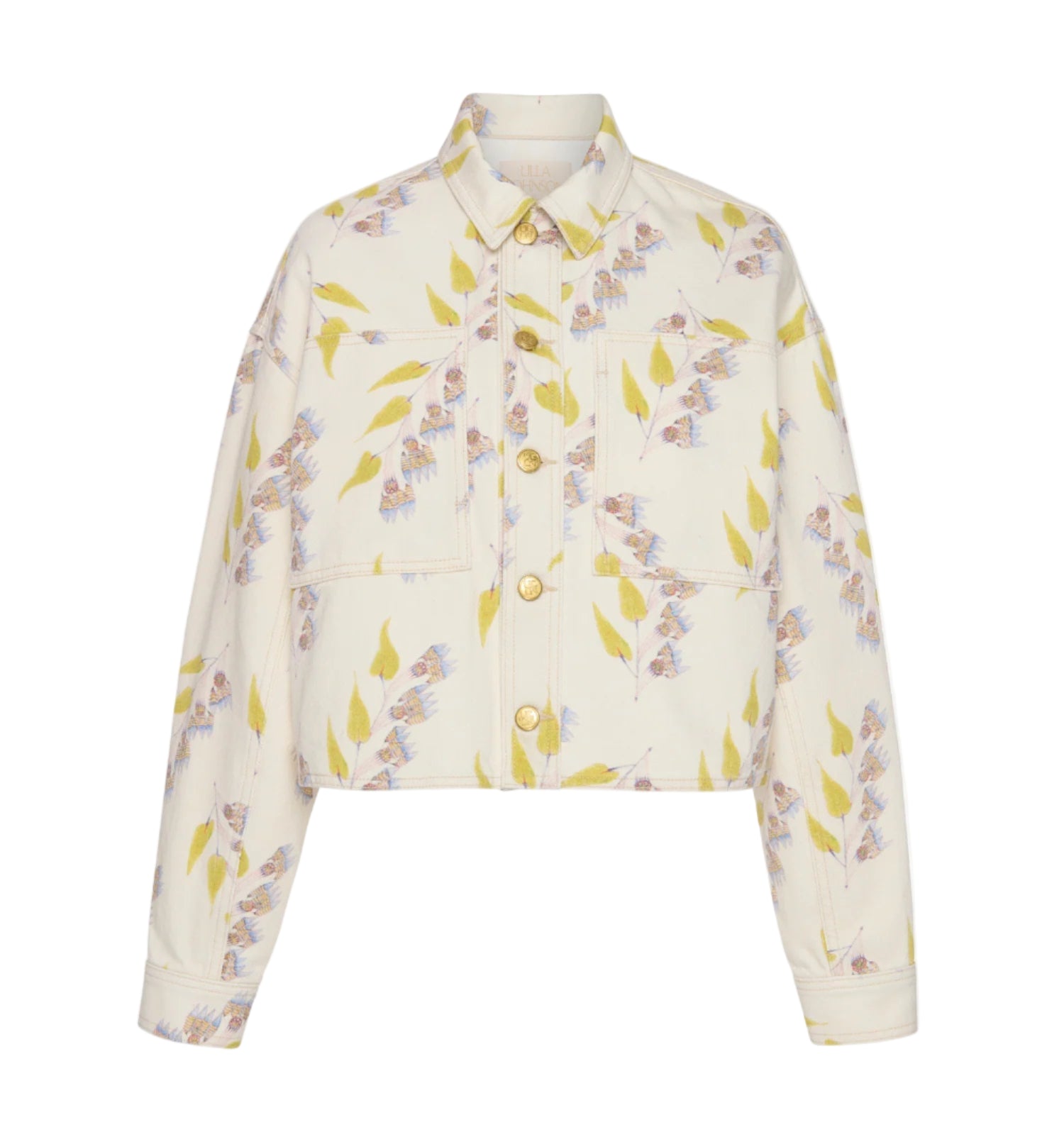 The Bobbi Cropped Denim Jacket by Ulla Johnson is a collared, button-front jacket with long sleeves and a subtle floral and leaf print on cream—an elegant, modern piece for any outfit.