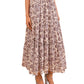Someone in the Ulla Johnson Nessa Skirt, a cream and purple cotton-blend skirt featuring an elastic waist and tiered design, paired with strappy heeled sandals.