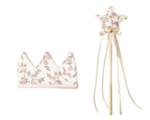 The Noralee Crown + Wand set features a floral fabric crown and matching star wand with ribbons in soft cream and pink, shown on a white background—perfect accessories for any royal celebration.