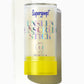 A Supergoop Unseen Sunscreen Stick SPF 40 with a yellow base is displayed beside a swipe of the clear sunscreen stick on a white background.