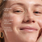 Close-up of a smiling person with minimal makeup; text overlay highlights Supergoop Unseen Sunscreen Stick SPF 40—clear, invisible, water- and sweat-resistant (40 mins), suitable for all skin tones/types, perfect over makeup.