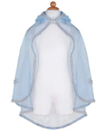The Great Pretenders Snow Queen Cape for children features light blue crystal organza, a hood, silver trim, and sparkling silver glitter stars on the sides. Displayed on a plain white mannequin.