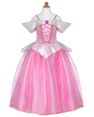 The Great Pretenders Deluxe Sleeping Cutie Gown is a child-sized pink dress with gold trim, sheer accents, and an off-the-shoulder design made from premium satin, shown on a dress form.
