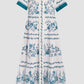 The Erdem Wild Fern Botanical Shirt Dress is a white midi cotton-linen blend with teal fern embroidery, tiered skirt, and teal-trimmed sleeves and hem, shown against a plain light backdrop.