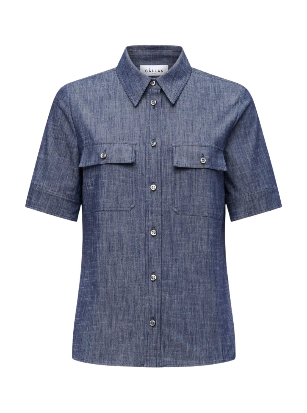 The Vesper Top by Callas Milano is a short-sleeved, button-up denim shirt with a collar and two front pockets, all in a rich Indigo color that exudes retro appeal.