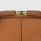 Close-up of a brown leather Victoria Small Doctor Bag by Victoria Beckham with visible stitching, gold clasp, and adjustable crossbody strap.