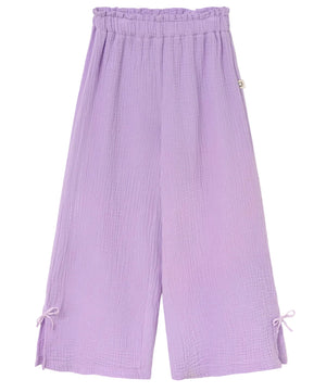 The Cozmo Girls' Violet Wide Pants are light purple cotton gauze pants with a crinkled texture, elastic waistband, and small bow accents at each leg hem.