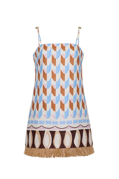 The Valencia Mini Dress by Cara Cara is a sleeveless mini shift dress with blue, brown, and beige geometric patterns, thin straps, and a raffia fringe hem.