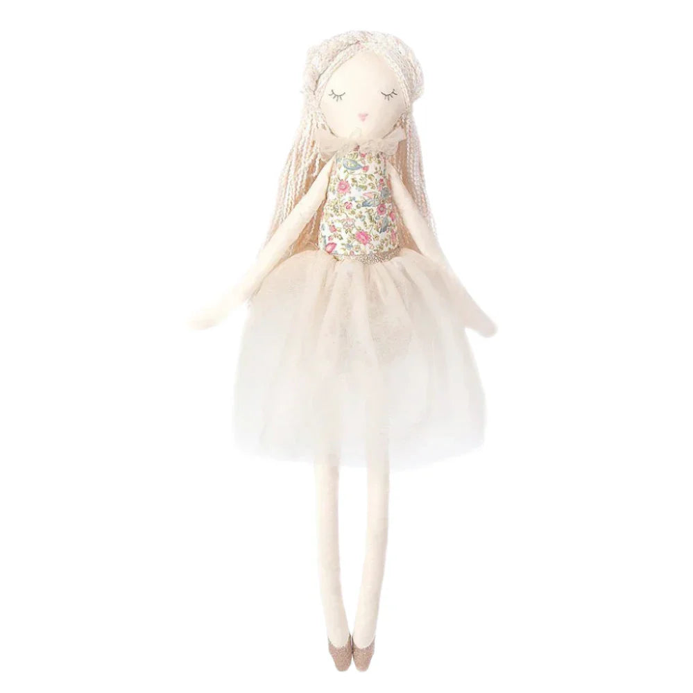 The MON AMI Vanilla Scented Doll by Mon Ami is an enchanting rag doll featuring an embroidered face, long braids, a floral top, and a white tulle skirt.