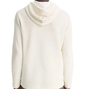 A person is shown from the back against a plain background, wearing the vince Variegated Stripe Double Face Hoodie—an off-white, textured everyday hoodie with a jersey-lined hood.