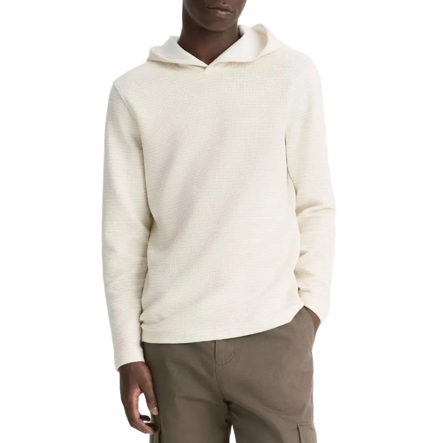 A person wearing the vince Variegated Stripe Double Face Hoodie in light beige with a jersey-lined hood and olive green pants stands with one hand in their pocket against a white background.