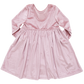 A Pink Chicken Girls' Velour Steph Dress, featuring long sleeves, a round neckline, and a fully gathered skirt, crafted from luxurious velour fabric in pink hue, laid flat and fully visible.