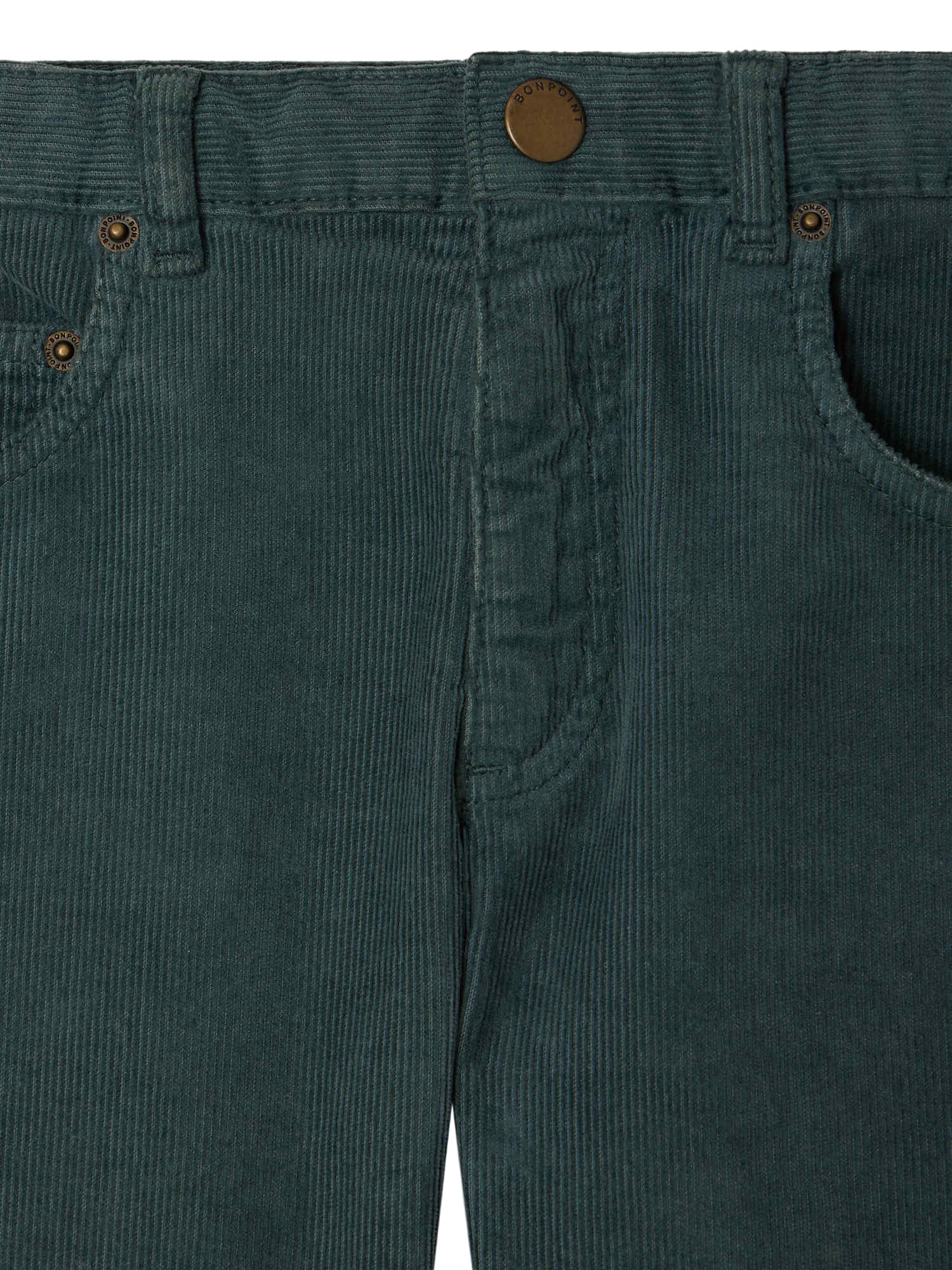 Close-up of the waistband and top section of Bonpoint Boys' Jagger Straight Trousers in Organic Cotton Velvet, featuring button, belt loops, and front pockets.