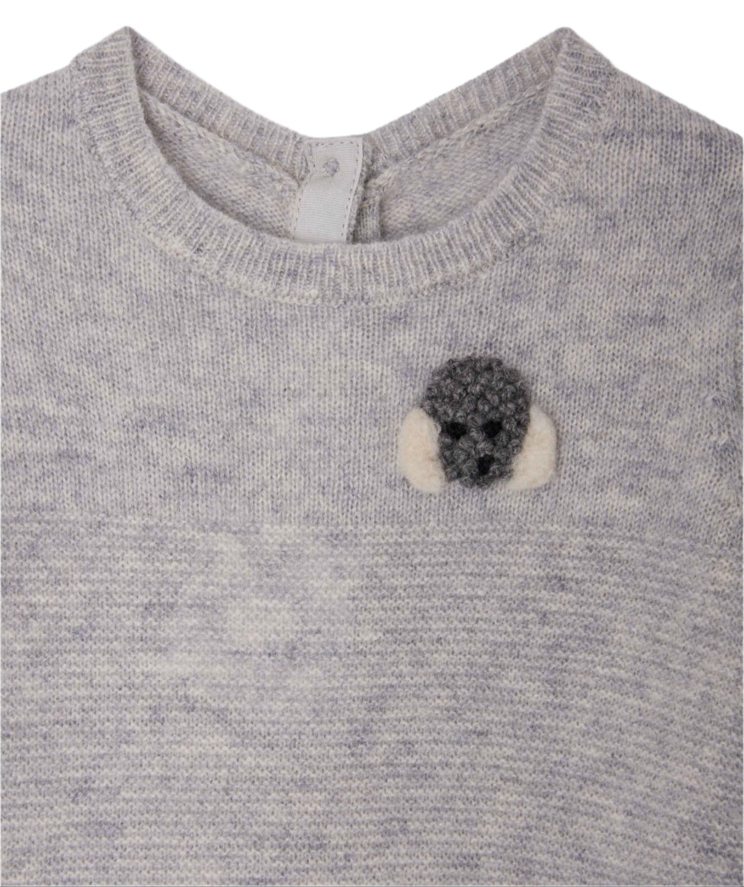 The Bonpoint Baby Boys' Tinoe All in One Outfit is a light gray knit with snap buttons and a small crocheted gray and white dog patch on the upper left chest.