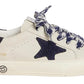 Cream-colored Bonpoint x Golden Goose Baby Sneakers featuring a black star patch, black heel tab, and patterned laces. “GGDB/LTD EDITION” is printed in gold on the side.