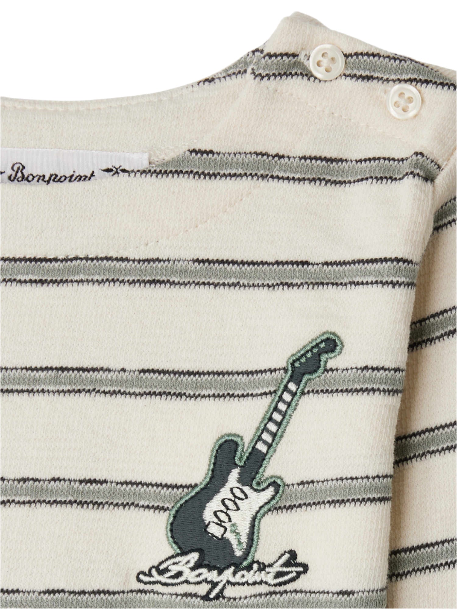 Close-up of Bonpoint's Baby Boys' and Boys' Tourbillon T-shirt in organic cotton, featuring green stripes, two shoulder buttons, and an embroidered electric guitar patch—a stylish choice for nautical-inspired baby clothes.