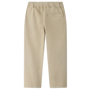 Boys’ Maurice Straight Pants by Bonpoint in beige, shown from the back, feature an elastic waistband and a single welt pocket on the right side, crafted from soft organic cotton.