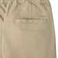 Close-up of Bonpoint Boys’ Maurice Straight Pants crafted from organic cotton, featuring an elastic waistband for added comfort. The back pocket has a horizontal opening with the Bonpoint embroidered logo positioned above it.