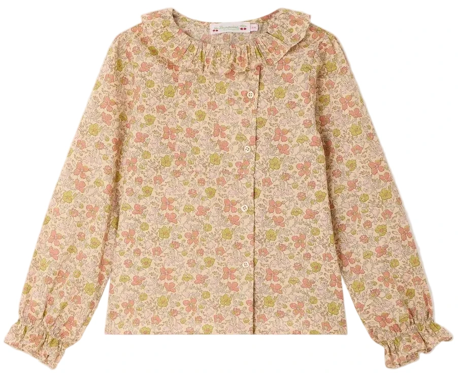 Girls’ Melusina Blouse in Liberty Fabric by Bonpoint, crafted from soft organic cotton and featuring a pink and green floral pattern on a light background, with long sleeves, ruffled collar, and cuffs.