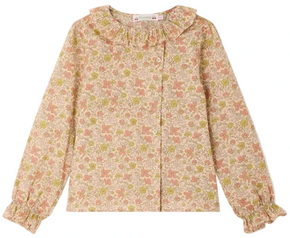 Girls’ Melusina Blouse in Liberty Fabric by Bonpoint, crafted from soft organic cotton and featuring a pink and green floral pattern on a light background, with long sleeves, ruffled collar, and cuffs.