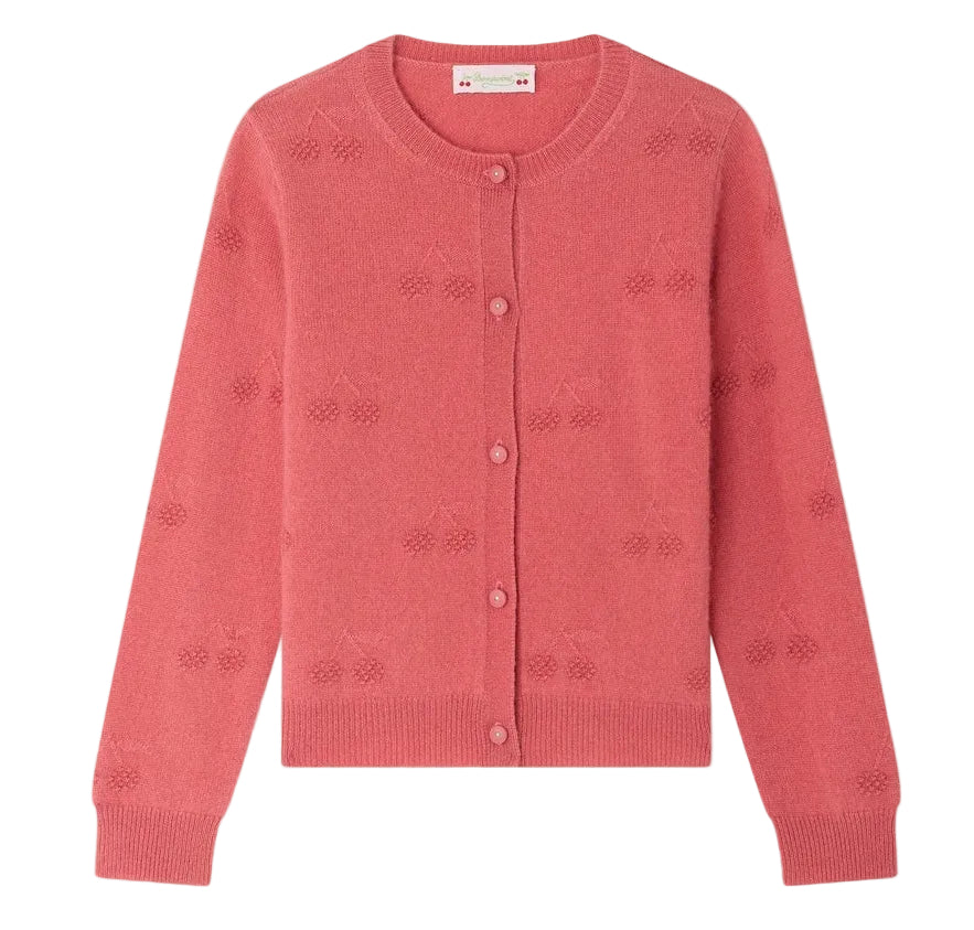 The Girls’ Manon Cardigan from Bonpoint is a pink cashmere cardigan featuring a round neckline and a delicate cherry pattern knitted throughout, blending timeless style with playful elegance for girls.