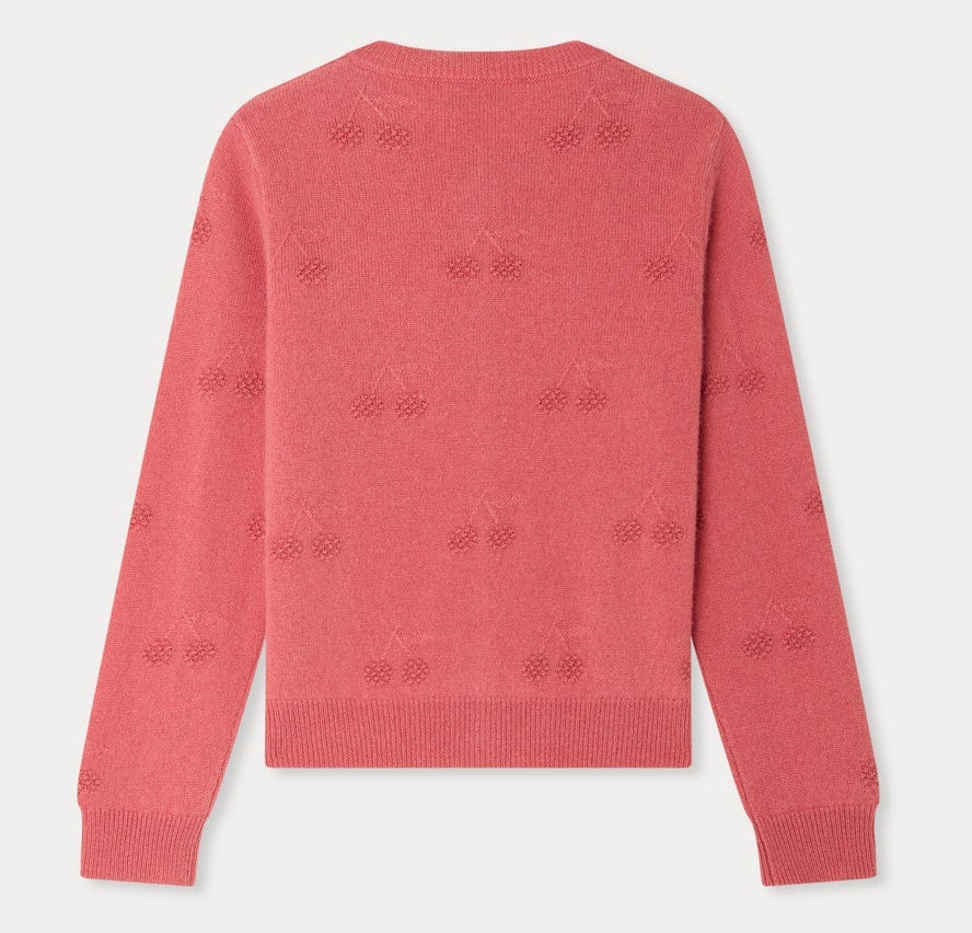 Back view of the Bonpoint Girls’ Manon Cardigan in pink, showcasing a subtle cherry pattern with ribbed cuffs, hem, and collar, displayed against a plain white background.