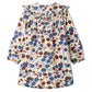 Introducing the Girls’ Bevika Dress in Organic Cotton Velvet by Bonpoint—a long-sleeved dress with a ruffled collar, adorned with a blue and brown leaf pattern on a cream background. Crafted in soft organic cotton velvet, this charming dress offers both comfort and warmth.