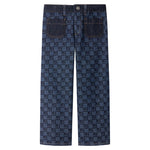 Back view of the Girls’ Minalie Cherry Checkerboard-Print Denim Trousers by Bonpoint, showcasing blue jeans with a dark checkerboard pattern and two back pockets, designed with an adjustable high waist, photographed on a white background.