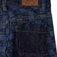 Close-up of the back pocket and waistband of the Bonpoint Girls’ Minalie Cherry Checkerboard-Print Denim Trousers, showcasing a brown leather brand label, adjustable high waist, and dark checkerboard pattern.
