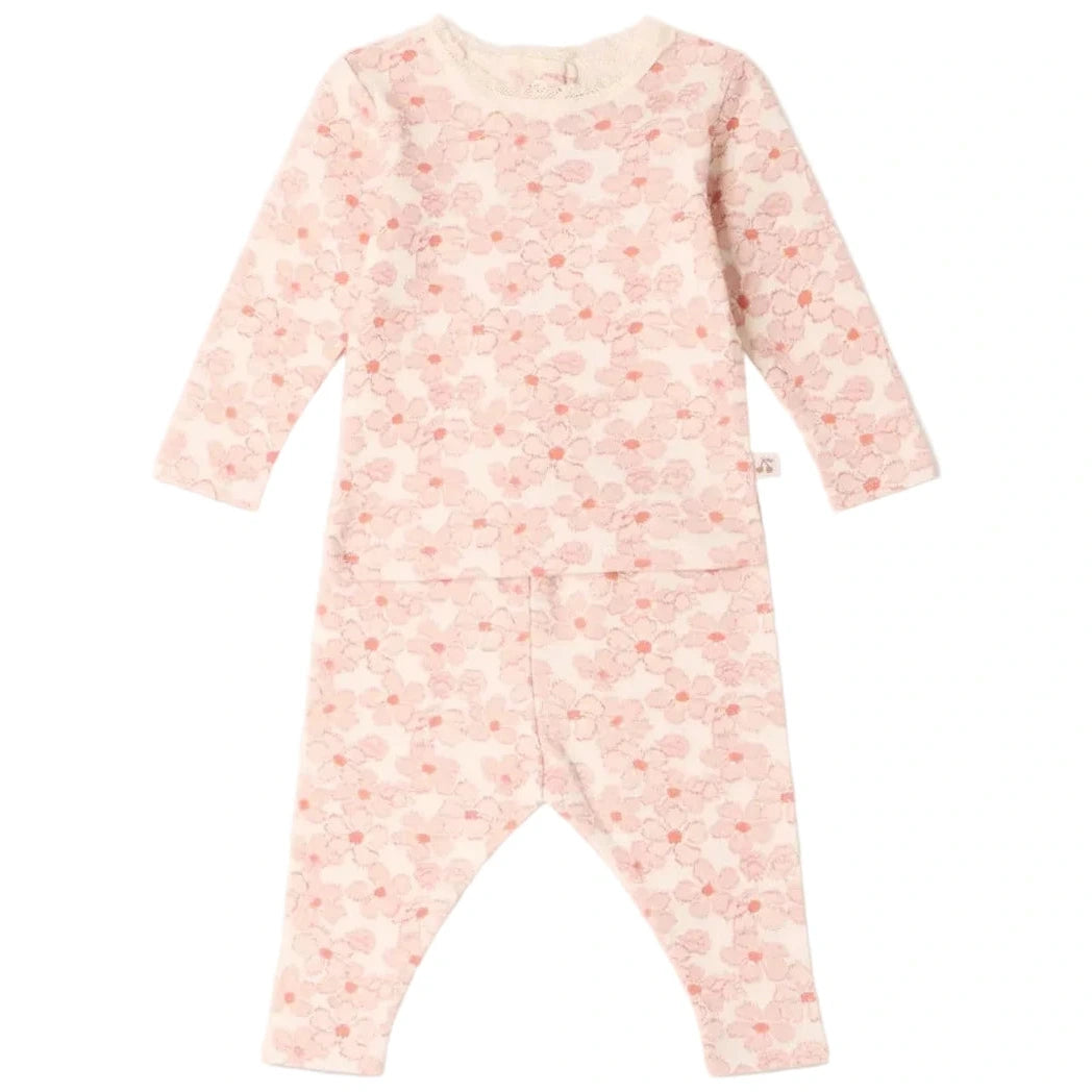 Bonpoint Baby Girls’ and Girls’ Genna Set—long-sleeve light pink pajama set featuring a charming cloud and dot pattern—crafted from soft organic cotton and displayed laid flat on a white background.