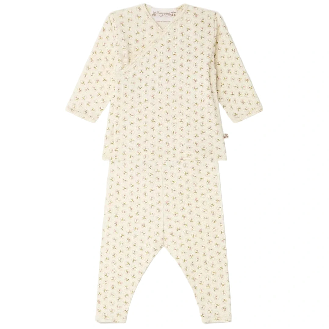 Baby Girl’s Timao Set with Cherry Print by Bonpoint, a two-piece organic cotton baby set featuring long sleeves and long pants, adorned with an all-over cherry print and convenient snap-button fastening, displayed on a white background.