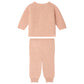 Baby Girls’ Ging Fancy-Stitch Set in Cashmere by Bonpoint, a light pink decorative knit ribbed sweater and matching pants set laid flat on a white background, reminiscent of a cozy cashmere baby set.