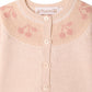 Bonpoint’s Baby Girls’ Jenny Set features a light pink knit cardigan with a round collar, cherry jacquard pattern on the yoke, and front buttons. Ideal for a cozy baby set or styled with matching pants for an adorable outfit.