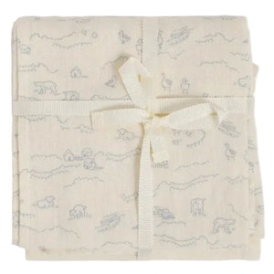 The Bonpoint Doudou Swaddle Blanket is a cream-colored muslin swaddle, crafted from organic cotton and adorned with a subtle animal and farm print. Elegantly folded and tied with a cream ribbon in a bow, it makes an ideal, thoughtful baby gift.