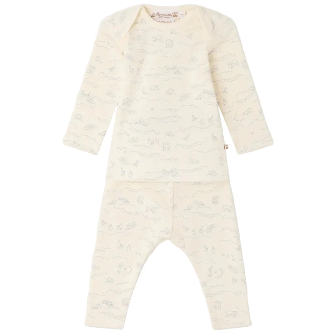 The Bonpoint Baby Timi Set with Sheep Print features a long-sleeve cream organic cotton top and matching pants adorned with a light grey animal and landscape motif. This comfortable baby outfit highlights an adorable sheep detail and is presented against a plain white background.