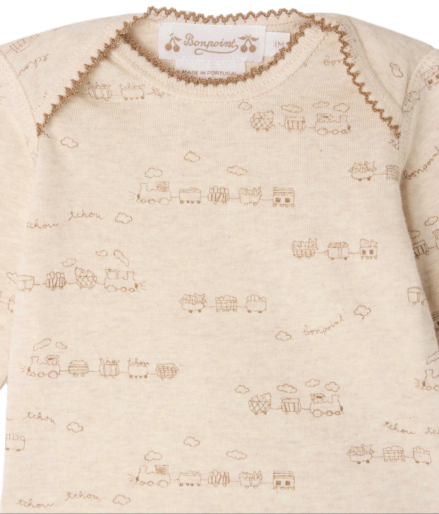Bonpoint Baby Boys’ Timini Set with Train Print—features a beige onesie adorned with brown trains and cloud patterns, designed with an envelope neckline and finished with a visible Bonpoint label at the collar. This set is crafted from organic cotton for ultimate comfort.