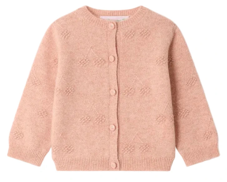 Bonpoint’s Baby Girls’ and Girls’ Tibile Cardigan with Cherries in Cashmere is a light pink, long-sleeve knit piece for children, featuring a round neckline, front button closure, and a subtle textured dot pattern inspired by the classic Tibile design.