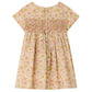 Bonpoint’s Baby Girls’ and Girls’ Maruska Dress in Liberty fabric is a short-sleeve style, smocked and hand-embroidered, featuring a charming floral pattern with pink and green flowers. Made from Liberty Tana Lawn, it includes two back buttons for easy dressing.